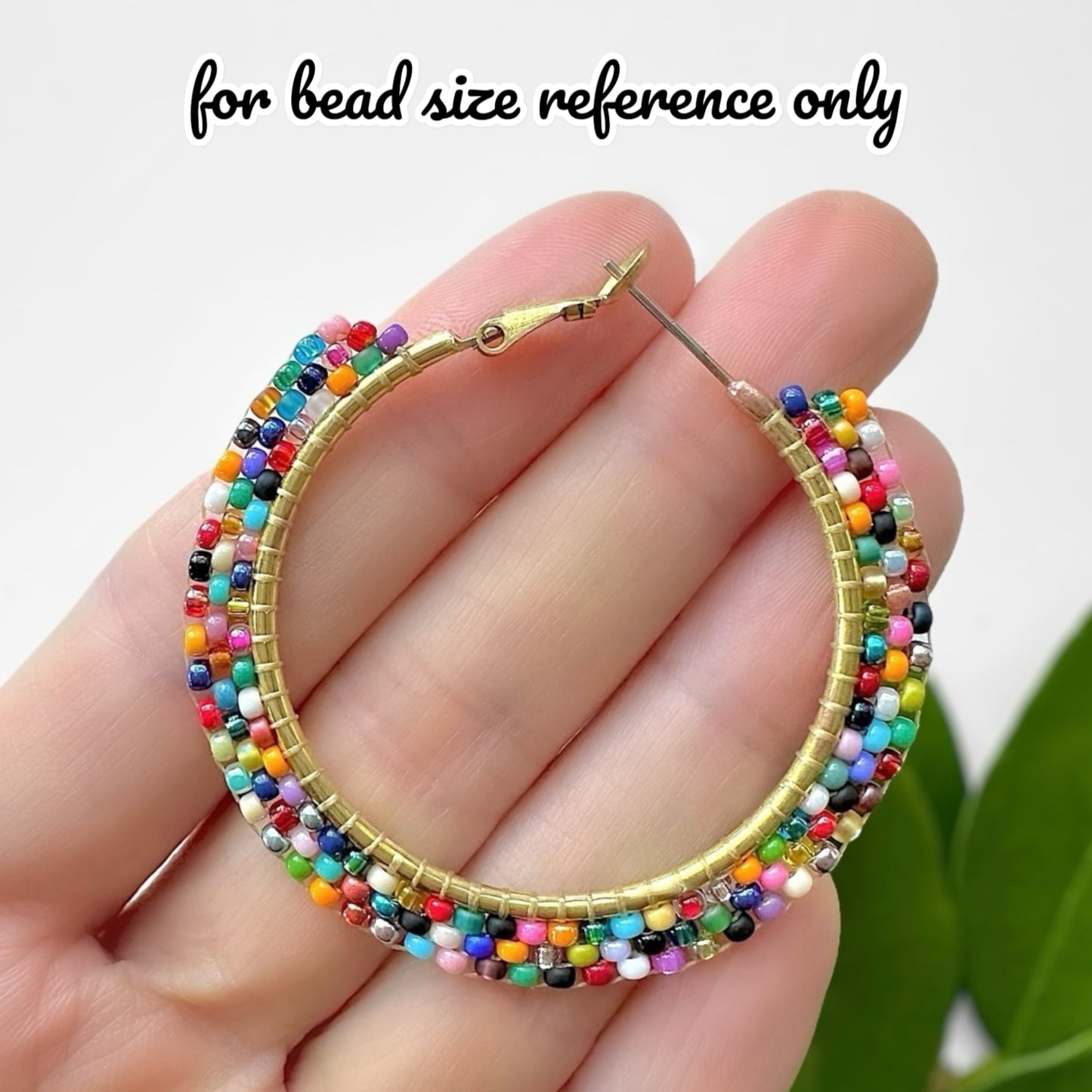 Miyuki size 11/0 seed beads weaved together on a brass hoop earring