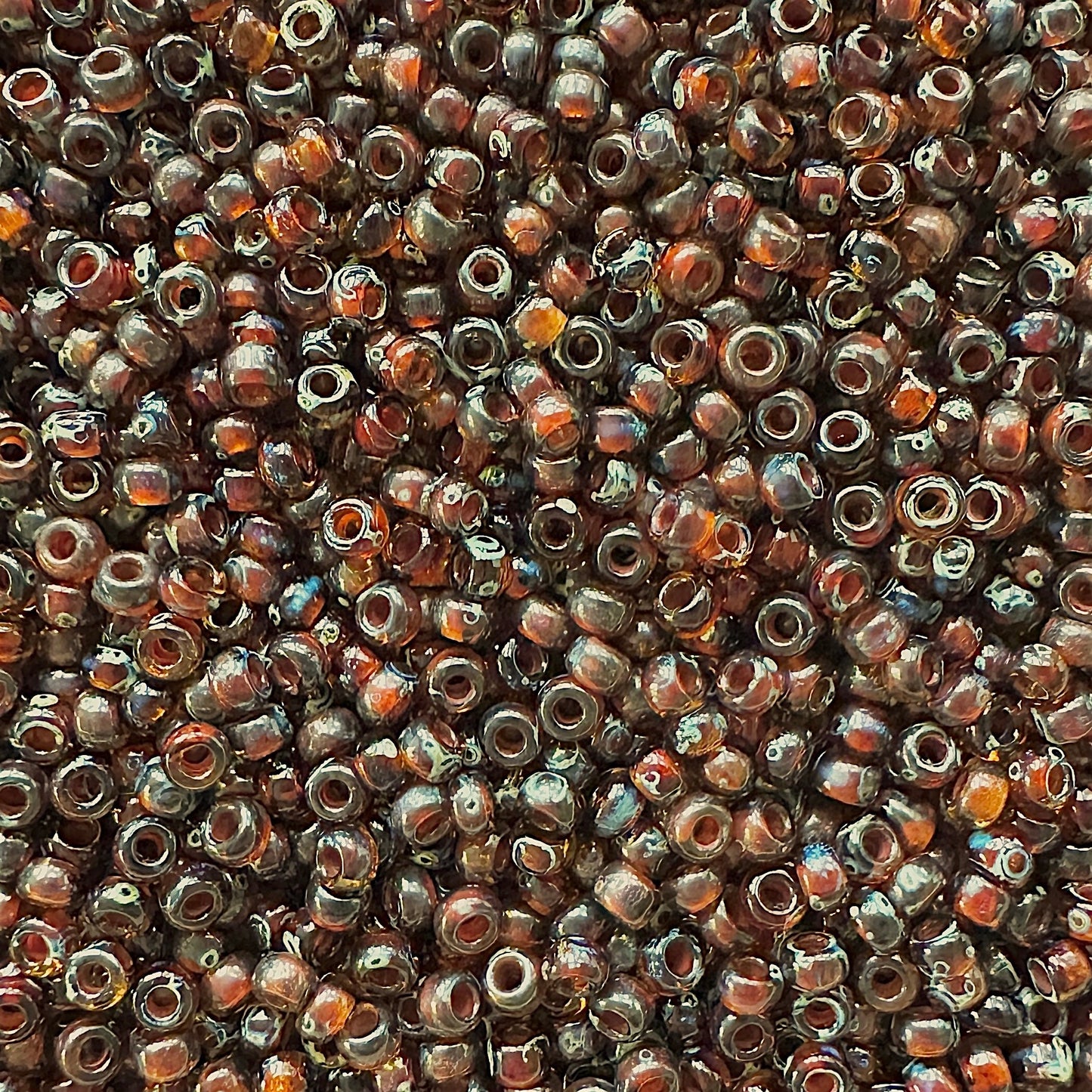 Miyuki 11 - 4502 Transparent Dark Topaz Picasso - The Bead Mix