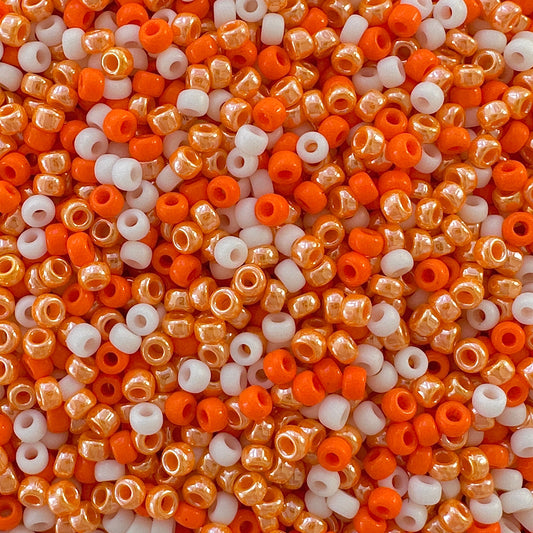 A mix of orange and cream 11/0 Miyuki seed beads by The Bead Mix