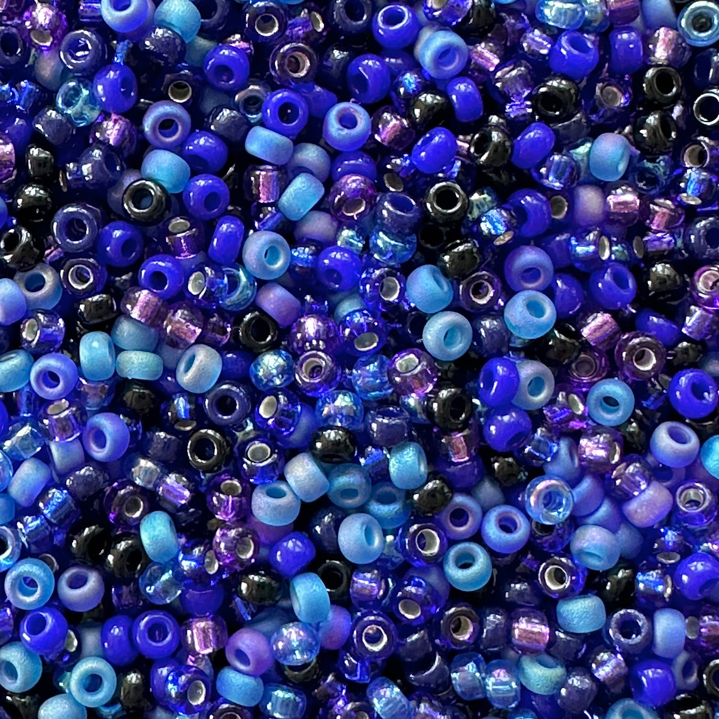 A mix of blue and purple Miyuki 11/0 seed beads created by The Bead Mix