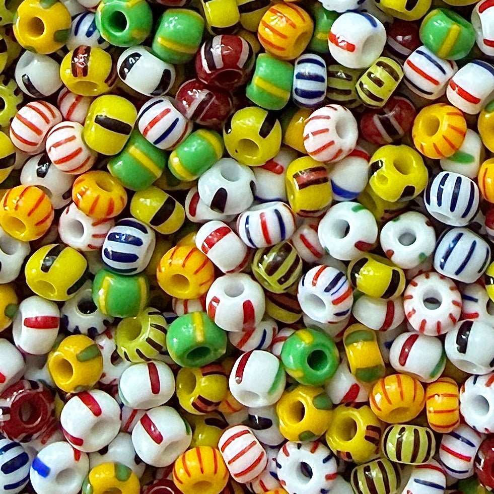 Mix of striped Czech 6/0 seed beads in yellow, green, black, white, red, and blue.
