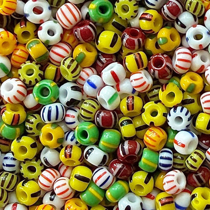 Mix of striped Czech 6/0 seed beads in yellow, green, black, white, red, and blue.