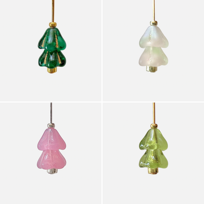 Four hanging beaded Christmas tree charms in green, white, and pink arranged in a 2x2 grid on a light gray background.