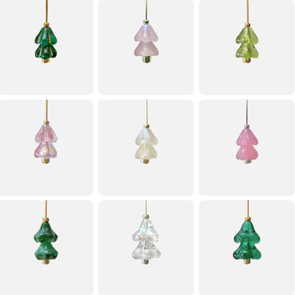 Nine hanging beaded Christmas tree charms in white, pink, and green arranged in a 3x3 grid on a light gray background.