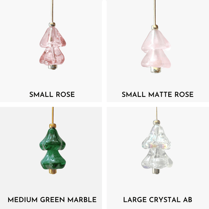 Four hanging beaded Christmas tree charms in pink, green, and crystal AB arranged in a 4x4 grid on a light gray background.