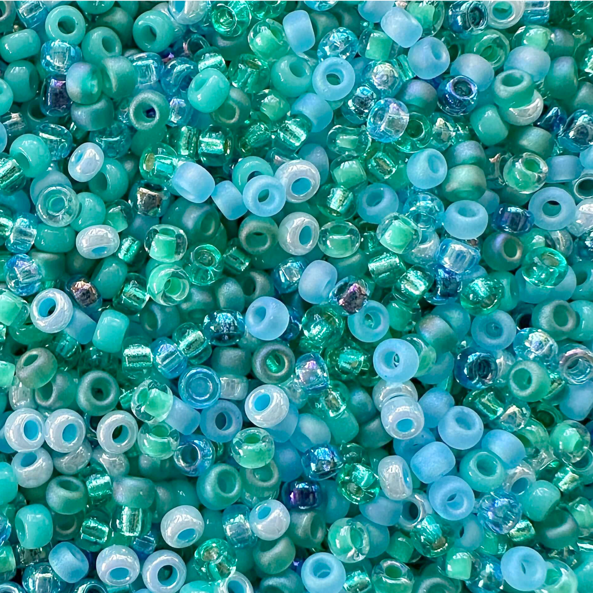 Mix of Miyuki seed beads in shades of green and blue with color swatches.
