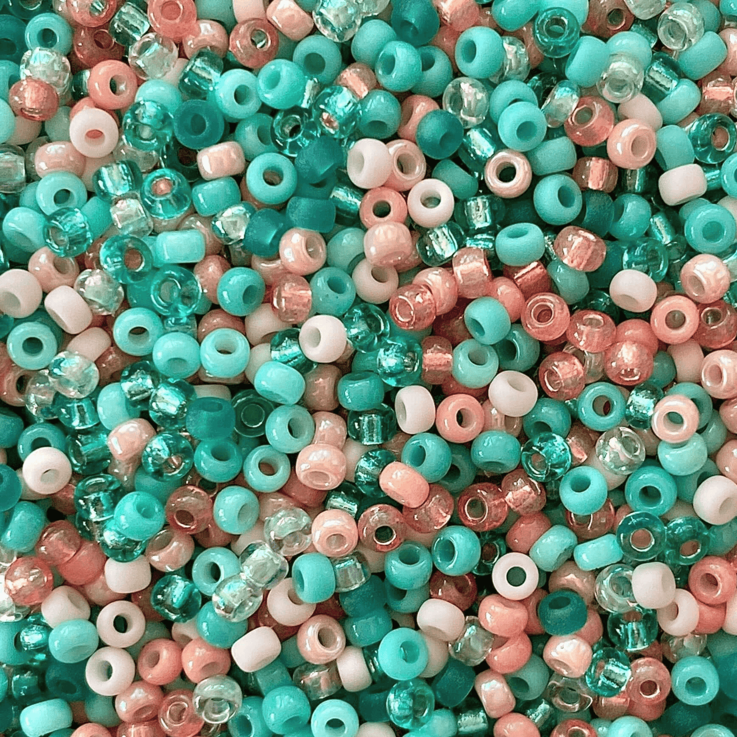 Mix of peach, teal and mint green Miyuki seed beads.