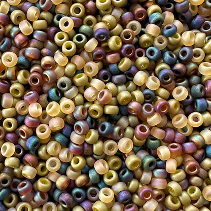 Mix of Miyuki seed beads in shades of shades of green and iridescent black and topaz.