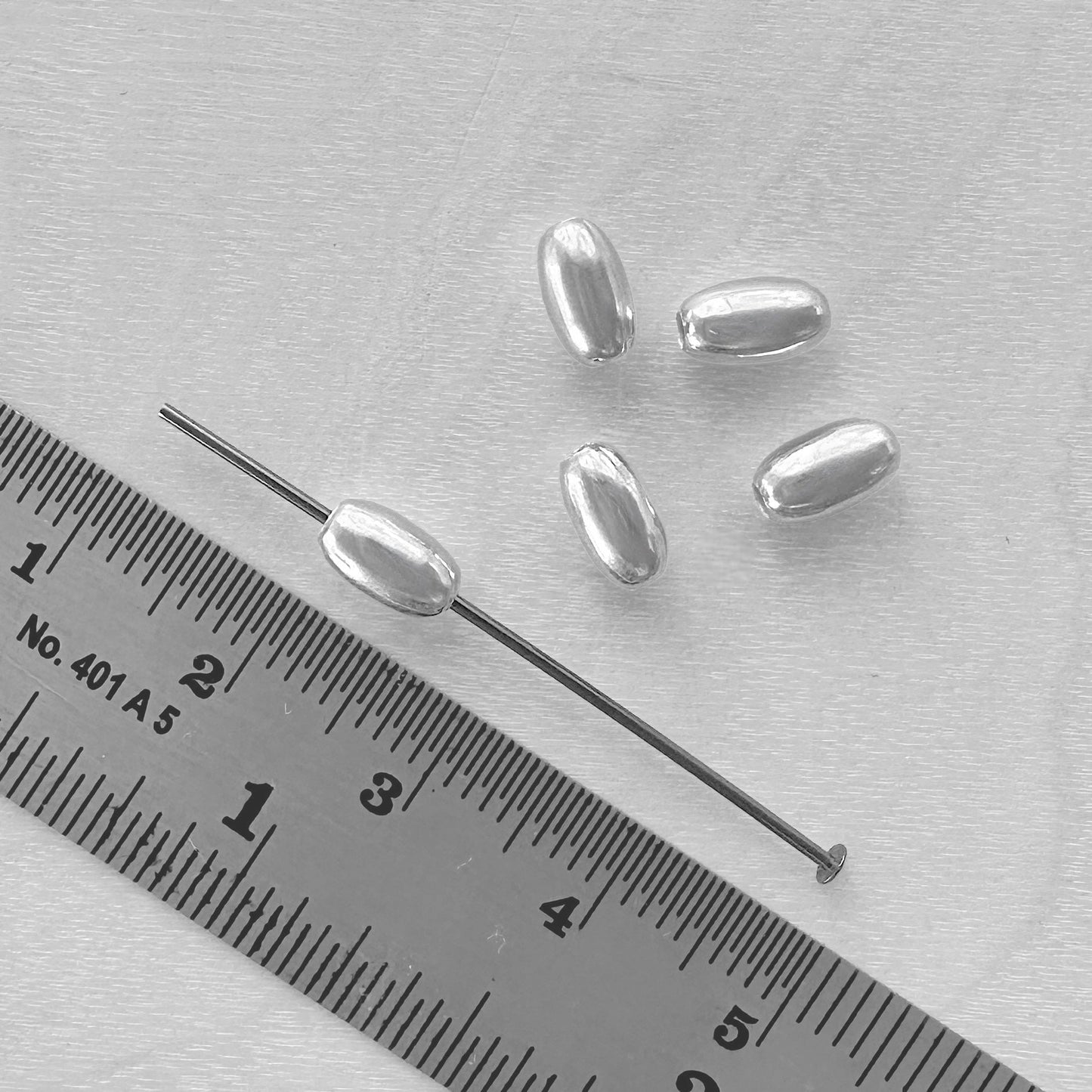 4 x 7mm Sterling Silver Oval Beads - The Bead Mix