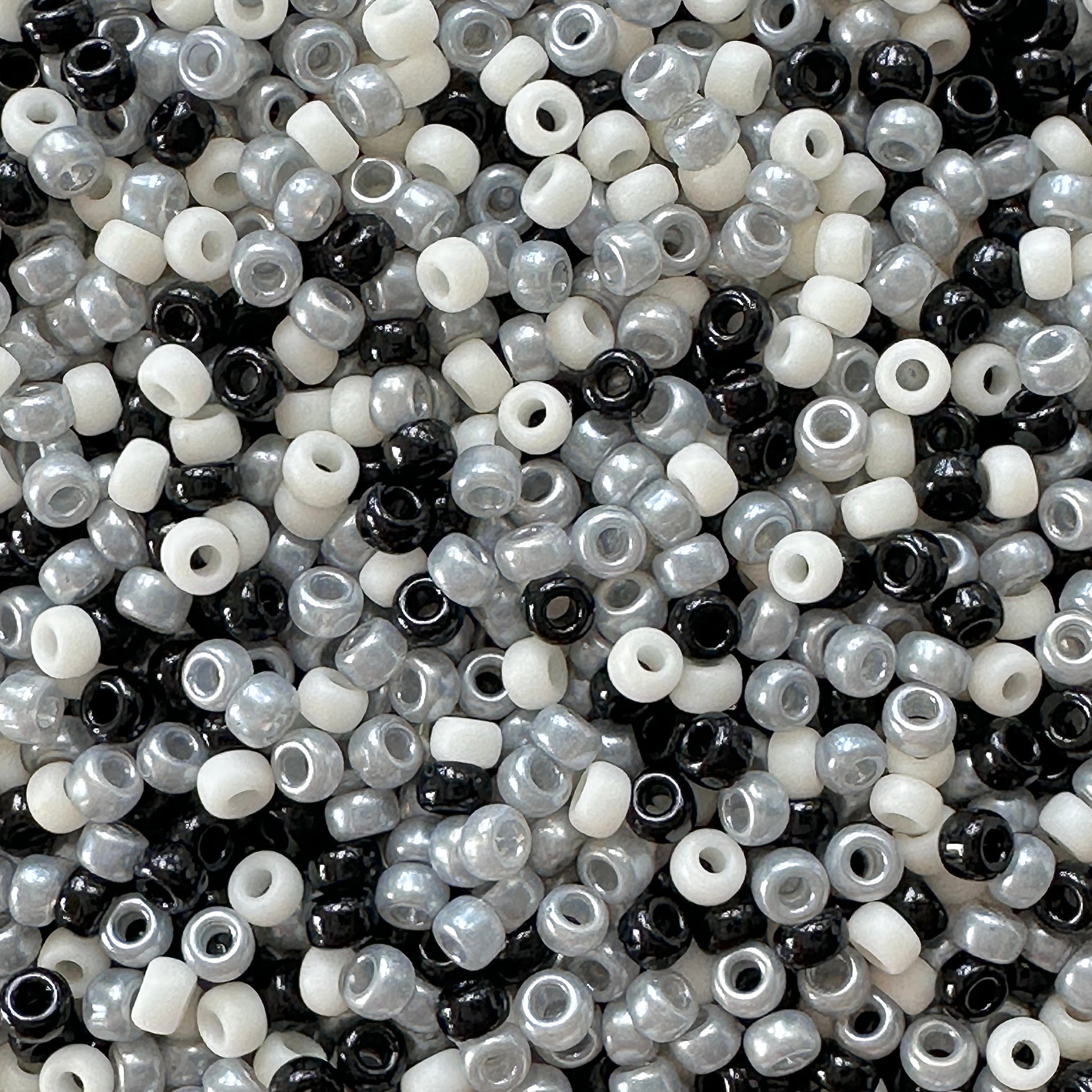 A mix of black and cream Miyuki 11/0 seed beads created by The Bead Mix